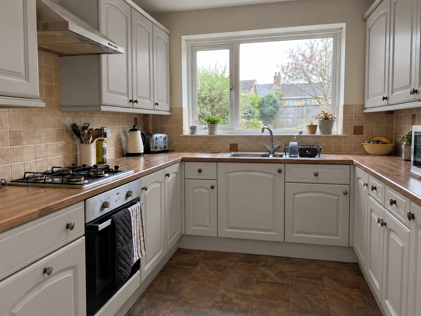 Kitchen cabinets after professional preparation and spray refinishing